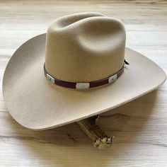 Genuine brown leather hat band decorated with silver metal conchos and turquoise colored stone. This hat band is adjustable with an attractive side buckle. Made in the USA Genuine Leather Adjustable sizing *This product is for 1 single hat band. Hat not included. Classic Cheap Hat Band One Size Fits Most, Brown Leather Hat, Country Hat, Silver Hat, Country Hats, Hat Bands, Leather Hat, Colored Stone, Leather Hats