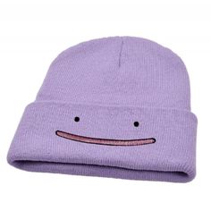 a purple beanie with a smiley face on it