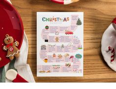 a christmas menu with gingerbreads and cookies on it next to a red plate