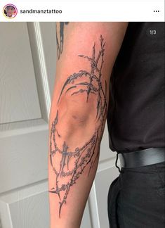 a man's arm with barbed wire on it