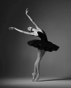 a black and white photo of a ballerina