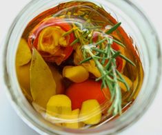 a jar filled with lots of different types of vegetables