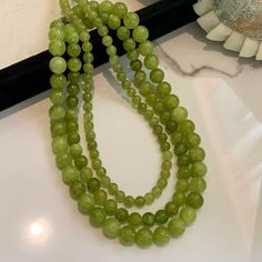 This exquisite necklace features natural green quartz beads paired with luxurious 24K gold-plated copper, making it a perfect blend of elegance and timeless charm. The earthy green hues of the quartz provide a refreshing, vibrant touch to your outfit, while the adjustable length allows for versatile styling. Whether worn for casual occasions or formal events, this piece elevates any look with its subtle yet captivating design. Details Material: Natural green quartz with 24K gold-plated copper Bead sizes: 6mm, 8mm, 10mm Total length: 46cm (including a 5.5cm adjustable chain) Weight: Available in 24g, 39g, and 60.42g options Missy Jewelry Natural Stone Necklace Collection Elegant Green Jade Crystal Necklace, Green Jade Necklace With 108 Beads, Elegant Jade Beaded Necklace With 8mm Beads, Elegant Jade Crystal Necklaces With Round Beads, Elegant Jade Crystal Necklace With Round Beads, Elegant Green Crystal Necklace With Natural Stones, Green Aventurine Round Beaded Necklaces, Green Aventurine Beaded Necklaces, Green Aventurine Round Beaded Necklace