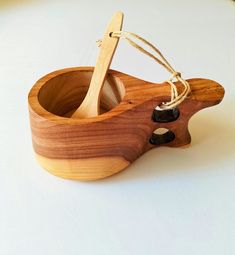 a wooden toy with a spoon in it