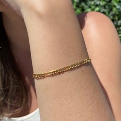 A good classic never goes out of style! Our 14K gold filled medium figaro style chain bracelet looks stylish on it's own or paired as a wrist stack! What is Gold Filled? Gold filled products consist of an actual layer of gold that is pressure bonded to another metal. Gold filling is one of the most valuable and tarnish resistant processes for creating gold jewelry and other items. If properly cared for, your gold filled product can last a lifetime and thanks to its durability, there's no need to