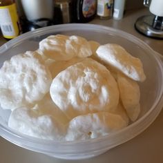 a plastic container filled with food on top of a table