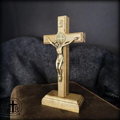 This is one of the nicest table crucifixes we've ever seen. The wood is walnut and it is nice and thick as the cross should be. The Corpus of Jesus Christ is metal and has an Olde World antique brass finish as does the matching metal St. Benedictine devotional on the front and reverse of the cross. The cross is pegged onto a tabletop base that can be easily removed to optionally hang on the wall. Quality made in Brazil. Solid Walnut Cross Beautifully Detailed Metal Corpus of Jesus Saint Benedict Combat Rosary, Rugged Rosary, Wax Stamp Kit, Paracord Rosary, Mini Rosaries, Custom Rosary, Catholic Crucifix, St Therese Of Lisieux, Faith Jewelry