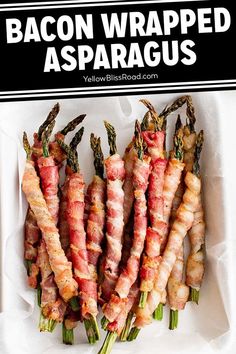 bacon wrapped asparagus on a white plate with black and white text overlay