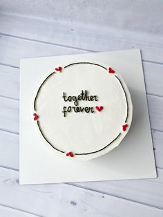 a cake with the words together to never written on it