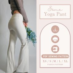 a woman in white pants holding a bouquet of flowers and wearing a yoga pant