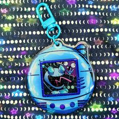 a blue keychain with a cartoon character on it