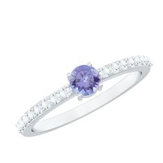 Product Details Celebrate lifes biggest moments with this luxurious Solitaire Ring, featuring a Round Shape Tanzanite stone in Prong Setting, accompanied by Surface Prong Set Diamond Side Stones. This exquisite ring is a beautiful and timeless piece of jewelry that is sure to be treasured for years to come. Product Information SKU SHP-RINGS0721123295 Width 5 mm Height 3.5 mm Weight 1.60 gm (Approximate) TANZANITE INFORMATION No.of Stones 1 Pieces Total Weight 0.54 Carat (Approximate) Dimension(a Tanzanite Birthstone Ring With Center Stone For Promise, Tanzanite Birthstone Ring For Promise, Tanzanite Promise Ring With Prong Setting, Promise Tanzanite Rings With Prong Setting, Tanzanite Prong Setting Promise Ring, Tanzanite Ring With Prong Setting For Promise, Tanzanite Rings With Prong Setting For Promise, Tanzanite Ring With Prong Setting In Round Cut, Tanzanite Ring With Prong Setting