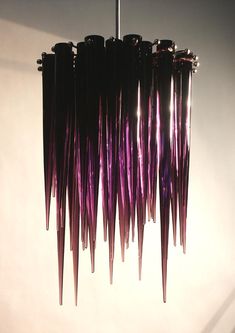 a purple chandelier hanging from a ceiling