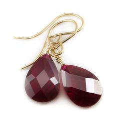 These are teardrops of cubic zirconia in a red ruby faceted cut. The sparkle is amazing! The french earwires are Sterling Silver or 14k Solid Gold or 14k Gold Filled - you choose. The stone size is a large 9x13mm. The earrings hang 1.1 inch. This is high quality AAA CZ. There is 15 carats of CZ. A great wardrobe staple, these go with lots of outfits. The mannequin shows the relative size and how they will hang. Shipping is Free! Teardrop Ruby Jewelry In Yellow Gold, Red Teardrop Birthstone Jewelry, Classic Pear-shaped Ruby Jewelry, Fine Jewelry Ruby Teardrop, Faceted Teardrop Red Jewelry, Faceted Drop Teardrop Earrings For Gift, Ruby Teardrop Fine Jewelry, Diamond Cut Pear Teardrop Earrings For Gift, Ruby Teardrop Jewelry With Matching Earrings