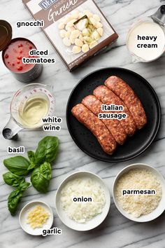 ingredients to make italian sausage on a marble counter top