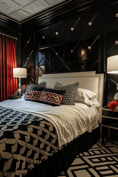 a black and white bedroom with red drapes on the window sill, two nightstands, and a large bed