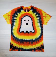 a tie - dyed shirt with a ghost on it