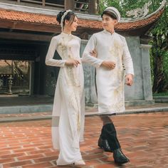 👉 7 DAY REFUND SUPPORT FOR CUSTOMERS IN VIETNAM * Still a Vietnamese girl walking down the street, how beautiful are her innovative ao dai. Selected from the best materials, the 4-piece modern ao dai will bring her the perfect experience. * With a delicate ao dai design in the flower-embroidered sleeves, a little bit of momentum with a stylized side part, this innovative ao dai can turn any girl into a beautiful lady. , young, lovely. * Ao dai in different colors such as pink and beige helps he White And Gold Ao Dai, Ao Dai Design, Modern Ao Dai, Vietnamese Wedding Dress, Ao Dai Wedding, Vietnamese Girl, Bridal Suits, Vietnamese Wedding, Girl Walking