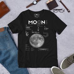 Introducing the Men's Moon And Lunar Data Graphic Tee by Infinite1 Brand. This t-shirt features a stylish graphic design depicting lunar data, perfect for astronomy enthusiasts. Made from high-quality materials, this tee is comfortable and durable for everyday wear. Available in various sizes and in classic black color. Stand out with this unique and trendy t-shirt that showcases your love for the moon and space. Elevate your casual wardrobe with the Men's Moon And Lunar Data Graphic Tee. Men's Short Sleeve Moon Print T-shirt For Streetwear, White Casual T-shirt With Moon Print, Moon Facts, Moon Print Relaxed Fit Crew Neck T-shirt, White Cotton T-shirt With Moon Print, Lunar Moon, Black Cotton T-shirt With Moon Print, Astronomy Lover, Black Shorts Men