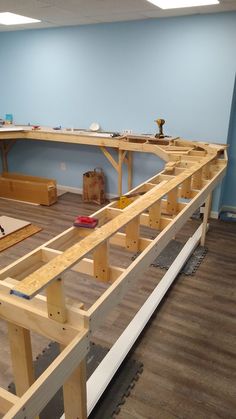 the room is being constructed and ready to be used as a workbench or workshop