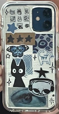 someone is holding up their phone case with stickers all over the back and sides