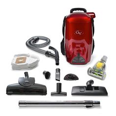 a red vacuum is surrounded by cleaning supplies