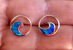 ".925 Sterling Silver Hawaiian Lab Opal Beach Wave Nalu Earrings. The size is 12MM, just under 1/2\". Meticulously crafted, these are always a top-seller in our Hawaii stores. The High-polished Sterling finish provides excellent reflectivity and durability. They are also nickel-free. These are high-quality very well-made earrings that are often bought for gifting. --The Opal colors shift between Ocean blue and Caribbean green with subtle to bright seemingly instantaneous iridescent flashes, depe Ocean-inspired Blue Nickel-free Jewelry, Ocean-inspired Nickel-free Blue Jewelry, Ocean Wave Earrings, Turquoise Ocean-inspired Sterling Silver Jewelry, Ocean-inspired Sterling Silver Beach Jewelry, Nickel-free Silver Ocean-inspired Earrings, Summer Ocean-inspired Silver Earrings, Ocean-inspired Blue Earrings For Gifts, Hawaiian Bracelets