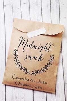 a brown paper bag with the words midnight snack on it and a tag attached to it