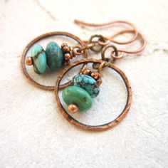 Two genuine turquoise semi precious stones are stacked on top of each other and dangled inside a hammered copper circle. They measure 1 1/4 from the top of the copper earwire and measure 3/4 wide. Very Lightweight and comfortable for all day wear.  All my jewelry comes in a box with a decorative ribbon ready for gift giving whether it is a gift for you or someone special.  See more of my jewelry here: https://www.etsy.com/shop/JensBeadBox  Thank you for visiting ... Diy Earrings For Beginners, Unique Turquoise Earrings, Genuine Turquoise Jewelry, Wire Jewelry Earrings, Hardware Jewelry, Semiprecious Stone Jewelry, Turquoise Jewelry Native American, Jewelry Turquoise, Unusual Earrings