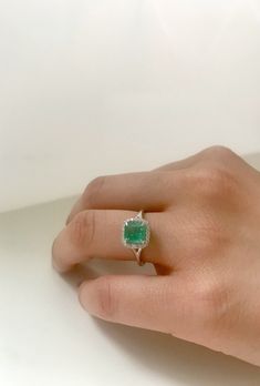 14k Gold, Micro Pave, Diamond Halo, Colombian Emerald ring. This fine statement ring would make a perfect gift for any occasion it can also be used as a stunning engagement ring. The Diamond halo along with the claw setting gives this ring it a chic yet classic look so that you turn heads where ever you go. Center stone: Colombian Emerald Centerstone weight: 1.20 ct Diamond halo: .15G color white diamond, VS clarity. Ring Size: Adjustable Made in: New York City Made to order If required, please Colombian Emerald Engagement Ring, Emerald Ring Designs For Women, Diamond Emerald Ring, Emerald Stone Rings, Colombian Emerald Ring, Anklet Tattoos, Claw Setting, Stunning Engagement Ring, Colombian Emeralds