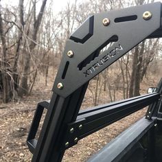 the back end of a truck with metal rivets