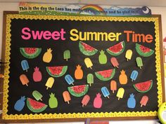 a bulletin board with watermelon and pineapples on it that says sweet summer time