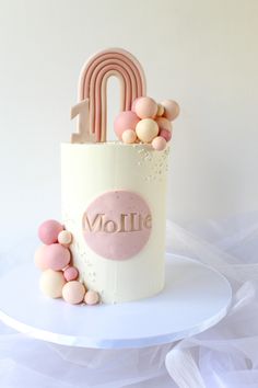 there is a cake that has been made to look like a bag with balloons on it