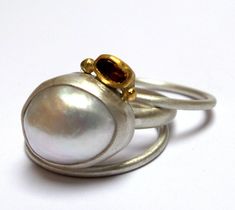 Pearl and Citrine Ring - The Pearl wrapped in sterling silver and Citrine stone wrapped in 24k solid gold, decorated with 24k solid gold dots. Round sterling silver band 3mm wide in Matte finish. The Pearl size is 14/11mm. The Citrine rose Cut stone size is 4/3mm. The ring size is 8US /56U. 2 sterling silver band ring 1.5mm. The ring will be packed in a Beautiful gift box. Free Shipping!! Your ring will be shipped via registered air mail with tracking number. Please contact me with any questions Chunky Silver Jewellery, Sterling Silver Rings Bands, Etsy Gold Ring, Citrine Ring, Citrine Stone, Gold Dots, Funky Jewelry, Ring Gemstone, Silver Pieces