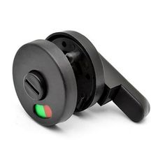 a black object with green and red lights on it's back end, sitting in front of a white background