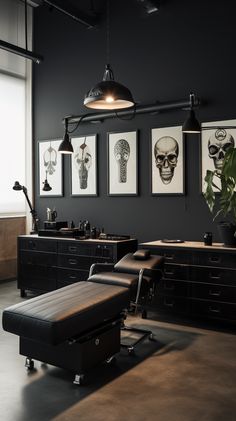 an office with black walls and art on the wall