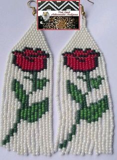 the beaded earrings are decorated with red roses