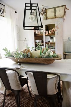 an image of a dining room table decorated for fall