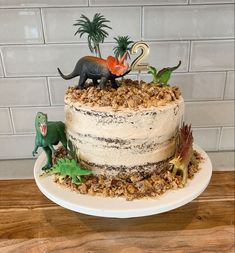 Dinosaur cake perfect for kids birthday Dinosaur Three Rex Cake, 3 Rex Dinosaur Cake, Dinofour Birthday Cake, Dino Cake 2nd Birthday, Homemade Dino Cake, Easy Dinosaur Birthday Cake, Roar Im 4 Birthday Cake, Dinosaur Eating Cake, Easy Dinasour Cake