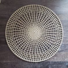 a white plate sitting on top of a wooden table