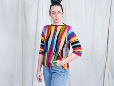 "AUNT GERTRUDE PRESENTS - vintage 3/4 sleeve multi colour sweater - materials: no label CONDITION (1-10 ❶❷❸❹❺❻❼❽❾ Great vintage condition. SIZE/MEASUREMENTS label: no label best fits: M/L chest: 42,5 inches (108 cm) length: 22,5 inches (57 cm) The model is 5'9\" (174 cm), measures 35-27-38 (90-67-95 cm) and wears size M" Retro Multicolor Tops For Fall, Multicolor 3/4 Sleeve Tops For Fall, Oversized Multicolor Retro Tops, 90s Style Multicolor Cotton Sweater, Fitted Multicolor Cotton Sweater, Retro Multicolor Sweater For Spring, Oversized Multicolor 90s Tops, Multicolor Fitted Tops With 3/4 Sleeves, Fitted Multicolor Tops With 3/4 Sleeve