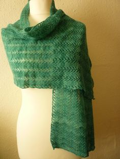 Soft and cosy jade green woollen scarf, hand dyed with natural variations, hand spun and hand knitted from British grown Polwarth wool. The pattern is the traditional Shetland vine lace, very delicate and pretty. Fabric is light and beautifully warm. 152 cms (60 inches) long by 43 cms (17 inches) wide. Gentle hand wash and dry flat. Hand Knit Blanket, Woolen Scarves, Pretty Beads, Knitted Shawls, Knitted Blankets, Jade Green, Hand Spinning, Crochet Scarf, Hand Dyeing