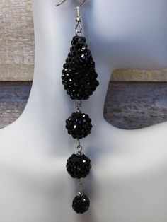 4.5 inches long oval and ball resin crystal pave black drop earrings with silver hook. Oblong pave measures 1.25 inches length, 1 inch wide and .13 inched thick. It has a slight curve that makes it unique and beautiful. These gorgeous statement earrings can be worn with any outfit from casual to formal evening gown. It adds a wow statement to a simple black dress to a formal evening gown. This earrings is handcrafted by me and it comes in a beautiful gift box. Please send me a message if you have any request, questions or problems regarding your order. Thank you for visiting and shopping. Black Dangle Earrings, Black Crystal Earrings, Black Drop Earrings, Pave Earrings, Formal Evening Gown, Simple Black Dress, Black Earrings Dangle, Earrings Elegant, Earrings Black