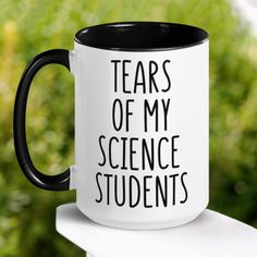 a black and white coffee mug with the words tears of my science students on it