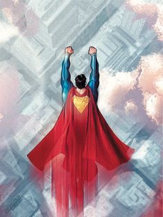 a man in a superman suit flying through the air with his hands up above his head