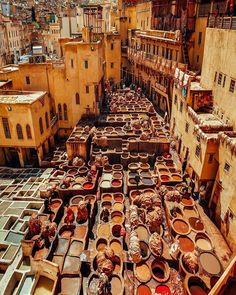 an old city with lots of barrels on the ground