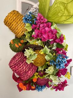 a bunch of flowers that are sitting on a door