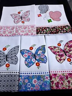 several different types of butterfly napkins on a table