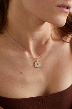 Marlo Laz's 'Coin' necklace is enameled with the French phrase  Porte Bonheur , which translates to 'Lucky Charm' - wear it as a symbol of good fortune. It's handcrafted from 14-karat gold and centered with a turquoise cabochon. It would make such a thoughtful gift. Turquoise Pendant Necklace With Clavicle Chain, Turquoise Engraved Round Pendant Necklace, Engraved Turquoise Necklace With Round Pendant, Turquoise 14k Gold Necklaces, Yellow Gold Enamel Medallion Necklace, Enamel Gemstone Pendant Necklace, Turquoise Medallion Necklace Engraved, Turquoise Engraved Pendant Necklace, Elegant Turquoise Pendant Charm Necklace