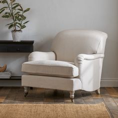 a white chair sitting on top of a wooden floor